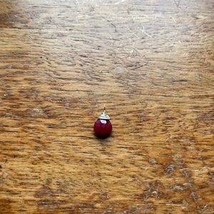 Sterling silver wire wrapped raw ruby pendant.